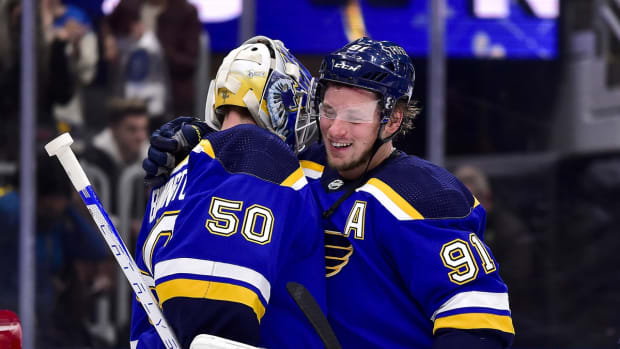 Dec 29, 2021; St. Louis, Missouri, USA; St. Louis Blues right wing Vladimir Tarasenko (91) and goaltender Jordan Binnington (50) celebrate after the Blues defeated the Edmonton Oilers at Enterprise Center. Mandatory Credit: Jeff Curry-USA TODAY Sports
